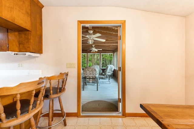 106 Bowdoinham Rd, Sabattus, ME 04280 - dining area featuring ceiling fan, vaulted ceiling, and a bar