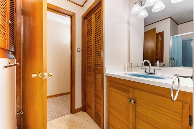 106 Bowdoinham Rd, Sabattus, ME 04280 - bathroom with tile patterned floors, vanity, crown molding, and a closet