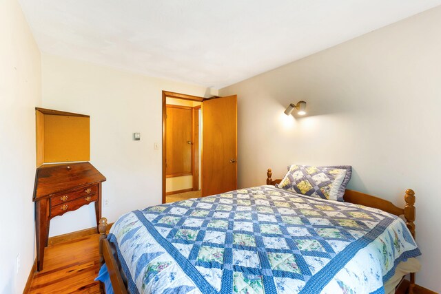 106 Bowdoinham Rd, Sabattus, ME 04280 - bedroom with wood finished floors and baseboards