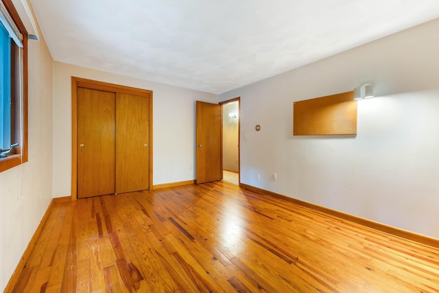 106 Bowdoinham Rd, Sabattus, ME 04280 - unfurnished bedroom with hardwood / wood-style flooring and a closet