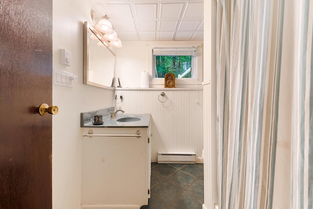 106 Bowdoinham Rd, Sabattus, ME 04280 - bathroom featuring a baseboard heating unit, vanity, and tile patterned flooring