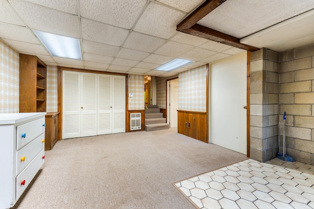 106 Bowdoinham Rd, Sabattus, ME 04280 - finished basement featuring stairway, a paneled ceiling, light colored carpet, and heating unit