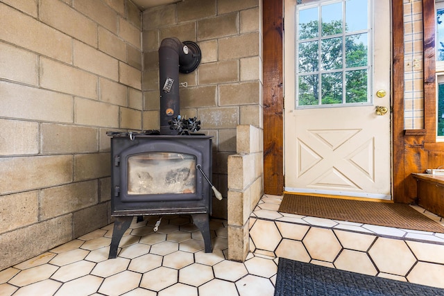 106 Bowdoinham Rd, Sabattus, ME 04280 - detailed view of a wood stove and concrete block wall