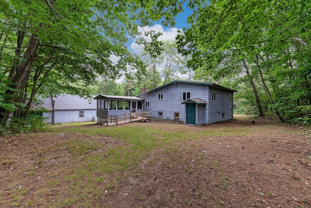 106 Bowdoinham Rd, Sabattus, ME 04280 - back of property with a sunroom and a chimney
