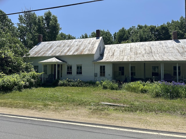 50 Church St, Weld, ME 04285 - view of front of home with a chimney and a metal roof