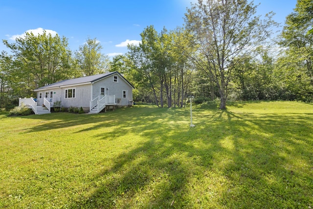 1165 Castine Rd, Penobscot, ME 04476 - view of grassy yard with a wooden deck