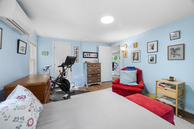 1165 Castine Rd, Penobscot, ME 04476 - bedroom featuring a wall mounted air conditioner and wood finished floors
