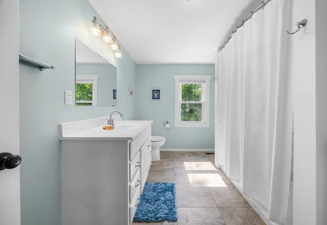 1165 Castine Rd, Penobscot, ME 04476 - full bathroom with healthy amount of natural light, vanity, tile patterned floors, and curtained shower
