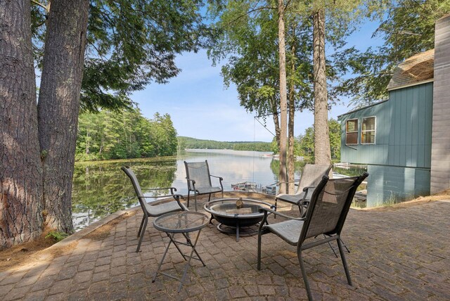 115 34th St, Acton, ME 04001 - view of patio featuring a fire pit and a water view