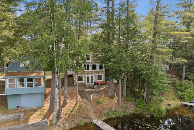 115 34th St, Acton, ME 04001 - rear view of property featuring a patio, french doors, and stone siding