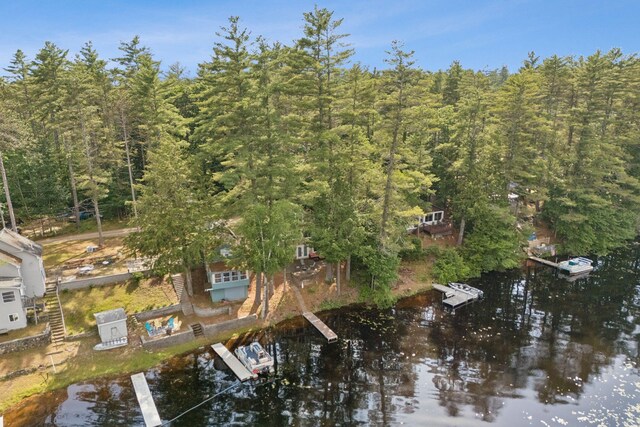 115 34th St, Acton, ME 04001 - aerial overview of property's location with a nearby body of water and a heavily wooded area