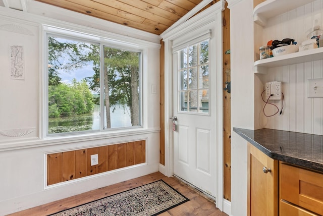 115 34th St, Acton, ME 04001 - doorway with light wood-style flooring and wooden ceiling