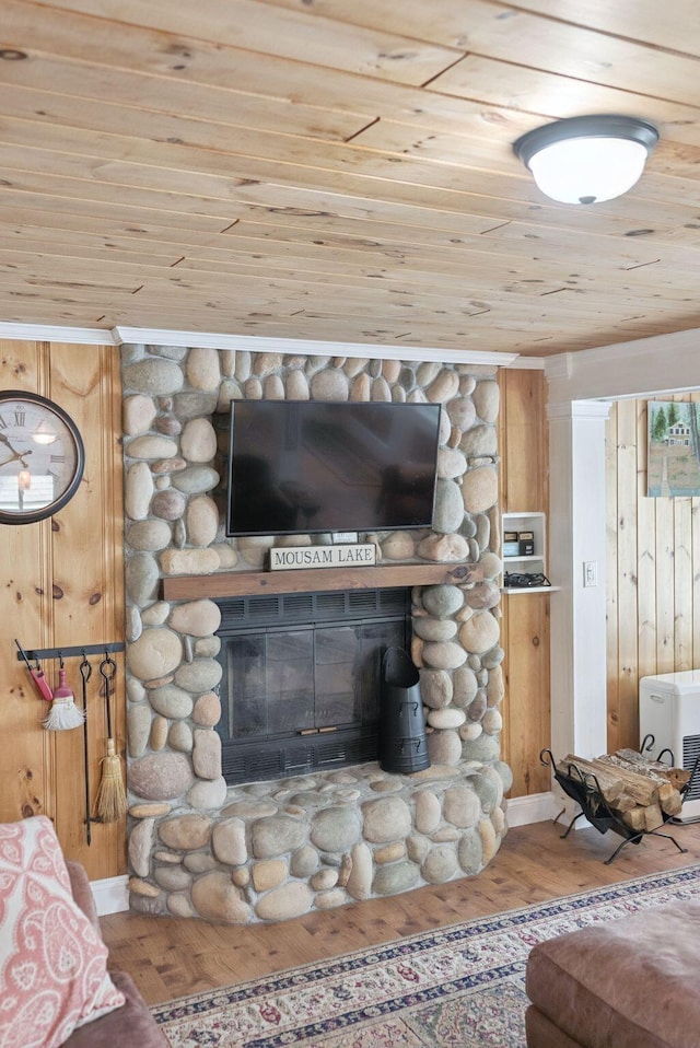 115 34th St, Acton, ME 04001 - detailed view of a fireplace, wood ceiling, wooden walls, and wood finished floors