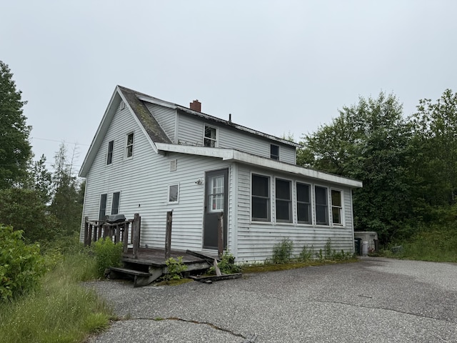 25 Douglas Rd, East Machias, ME 04630 - rear view of house featuring a deck and a chimney