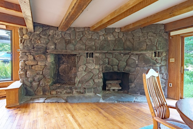 115 Swain Farm Rd, Rumford, ME 04276 - unfurnished living room with a fireplace, hardwood / wood-style flooring, and beamed ceiling