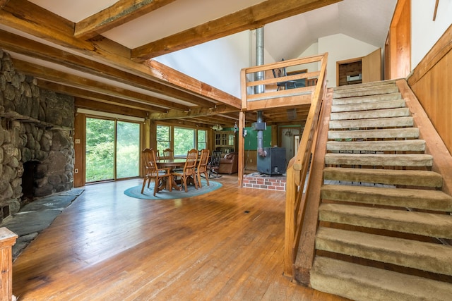 115 Swain Farm Rd, Rumford, ME 04276 - staircase with hardwood / wood-style floors and a stone fireplace