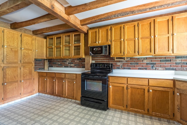 115 Swain Farm Rd, Rumford, ME 04276 - kitchen with black appliances, light countertops, brown cabinetry, beam ceiling, and glass insert cabinets