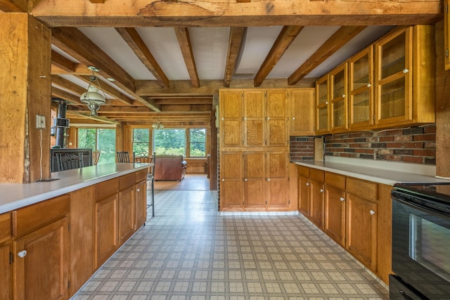 115 Swain Farm Rd, Rumford, ME 04276 - kitchen featuring electric range, light countertops, brown cabinets, beam ceiling, and glass insert cabinets