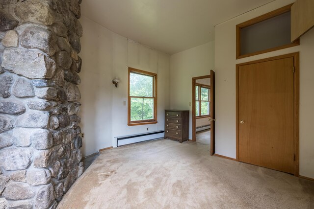 115 Swain Farm Rd, Rumford, ME 04276 - unfurnished bedroom featuring a baseboard radiator, light colored carpet, and baseboard heating