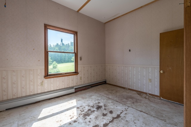 115 Swain Farm Rd, Rumford, ME 04276 - empty room featuring baseboard heating and a wainscoted wall
