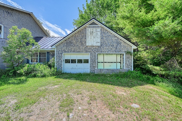 115 Swain Farm Rd, Rumford, ME 04276 - view of front facade with a standing seam roof, a garage, and a metal roof