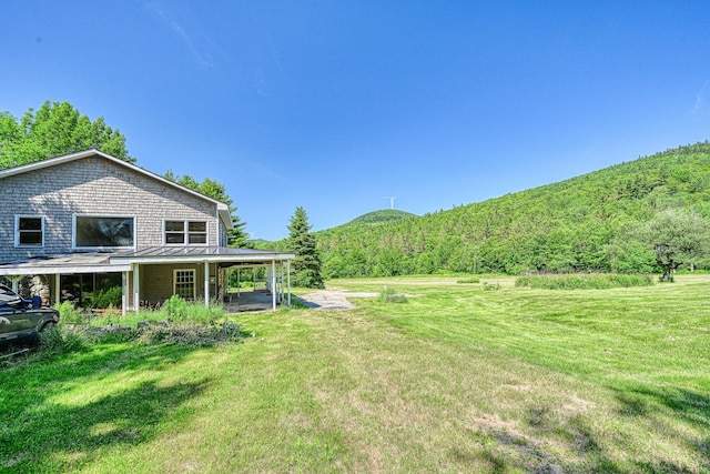 115 Swain Farm Rd, Rumford, ME 04276 - view of green lawn with a mountain view and a forest view