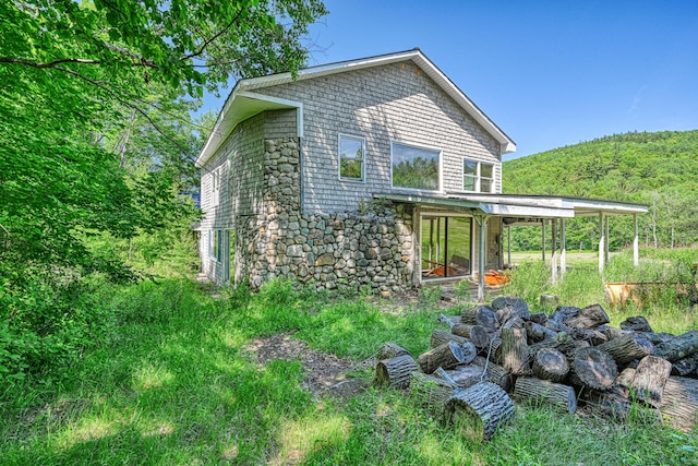 115 Swain Farm Rd, Rumford, ME 04276 - view of side of property with stone siding