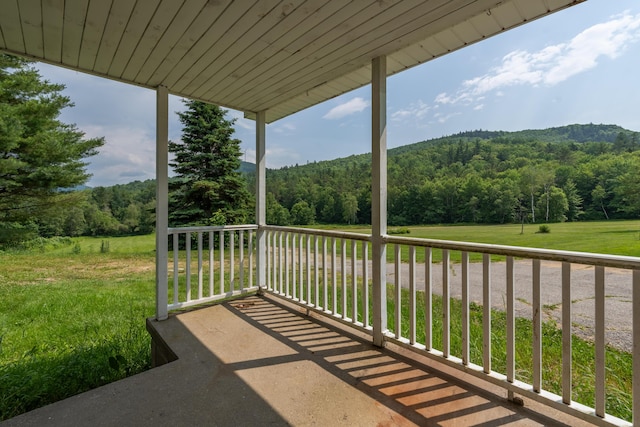 115 Swain Farm Rd, Rumford, ME 04276 - view of patio featuring a forest view
