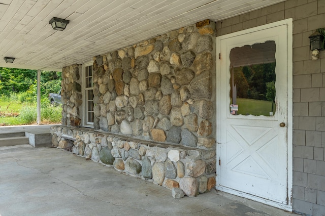 115 Swain Farm Rd, Rumford, ME 04276 - view of exterior entry with stone siding