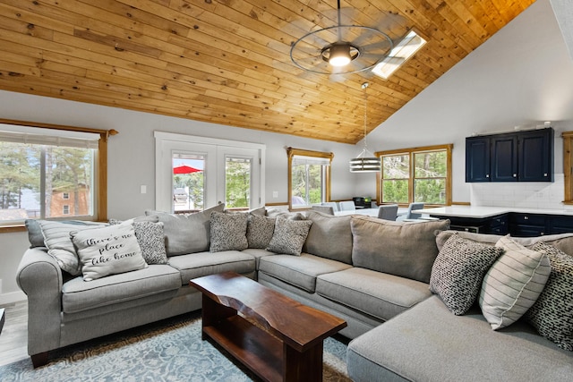 60 Butterworth Dr Unit 40, 46, Naples, ME 04055 - living area with plenty of natural light, high vaulted ceiling, wood ceiling, and wood finished floors