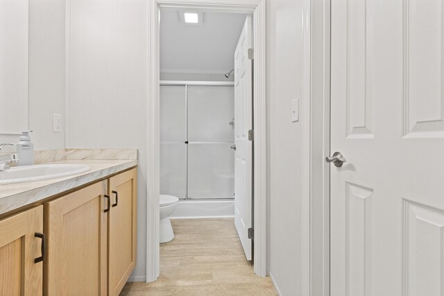 60 Butterworth Dr Unit 40, 46, Naples, ME 04055 - full bathroom with vanity, a stall shower, and wood finished floors