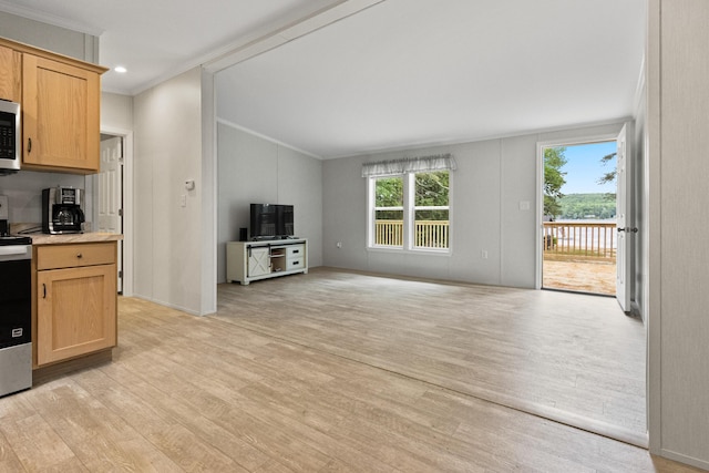 60 Butterworth Dr Unit 40, 46, Naples, ME 04055 - kitchen featuring ornamental molding, light wood finished floors, light countertops, lofted ceiling, and open floor plan