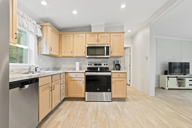 60 Butterworth Dr Unit 40, 46, Naples, ME 04055 - kitchen featuring appliances with stainless steel finishes, light brown cabinetry, ornamental molding, light countertops, and light wood-style floors
