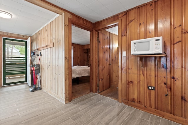 60 Butterworth Dr Unit 40, 46, Naples, ME 04055 - corridor with wood walls and light wood-type flooring