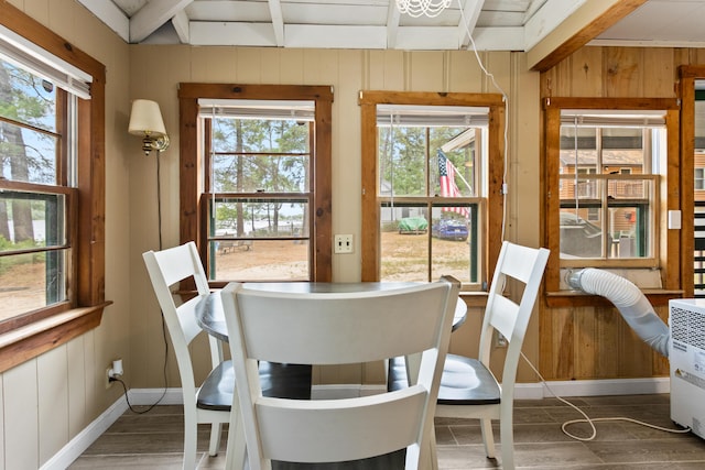60 Butterworth Dr Unit 40, 46, Naples, ME 04055 - dining area with wood walls, beam ceiling, and wood finished floors