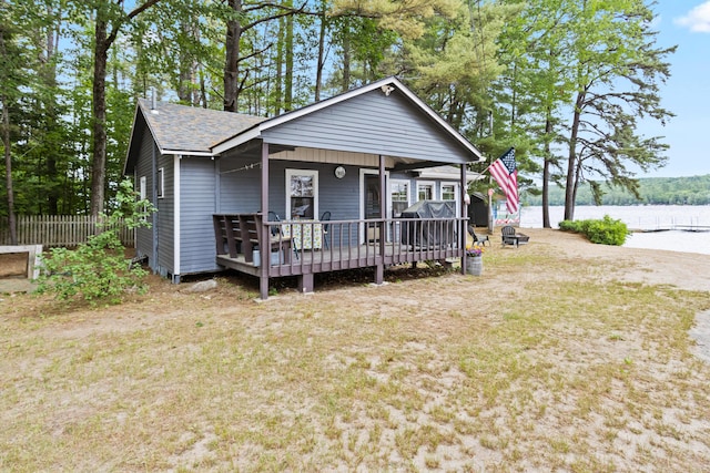 60 Butterworth Dr Unit 40, 46, Naples, ME 04055 - view of front of house featuring a deck with water view and a shingled roof