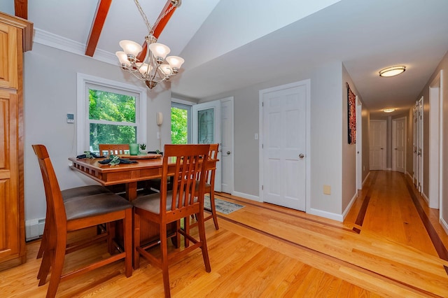 15 Vine St Unit B, South Berwick, ME 03908 - dining space with a chandelier, light wood finished floors, and vaulted ceiling