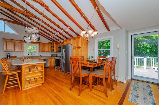 15 Vine St Unit B, South Berwick, ME 03908 - dining space featuring a chandelier, beam ceiling, light wood-type flooring, and high vaulted ceiling