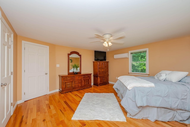 15 Vine St Unit B, South Berwick, ME 03908 - bedroom with a wall mounted air conditioner, light wood-type flooring, and ceiling fan