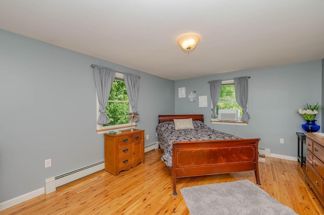 15 Vine St Unit B, South Berwick, ME 03908 - bedroom featuring a baseboard radiator, light wood-style floors, and cooling unit