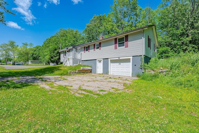 15 Vine St Unit B, South Berwick, ME 03908 - back of house with an attached garage, a chimney, and a yard