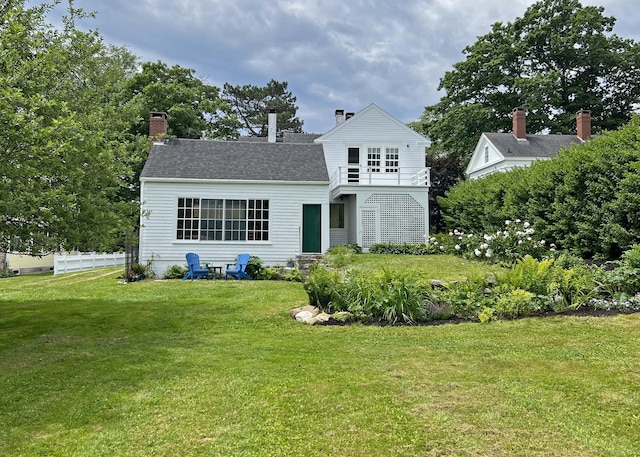 95 Main St, Castine, ME 04421 - view of front facade with a balcony, a chimney, and entry steps