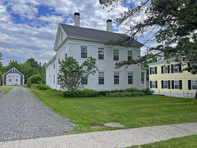 95 Main St, Castine, ME 04421 - view of side of home featuring a chimney and roof with shingles