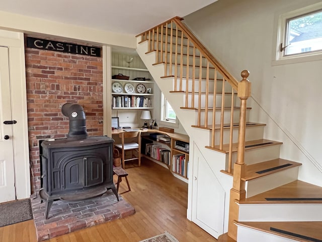 95 Main St, Castine, ME 04421 - stairs with wood finished floors and a wood stove