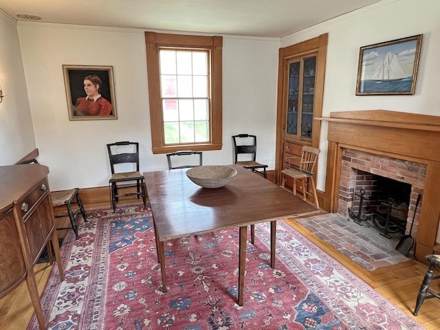 95 Main St, Castine, ME 04421 - dining room featuring a fireplace and wood finished floors