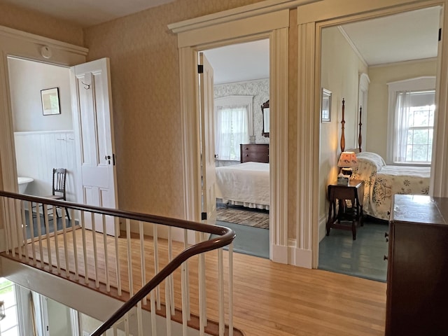 95 Main St, Castine, ME 04421 - hall with an upstairs landing, wood finished floors, plenty of natural light, and wallpapered walls
