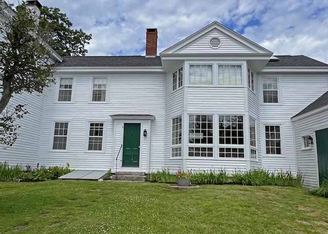 95 Main St, Castine, ME 04421 - back of house featuring a yard, a chimney, and a shingled roof