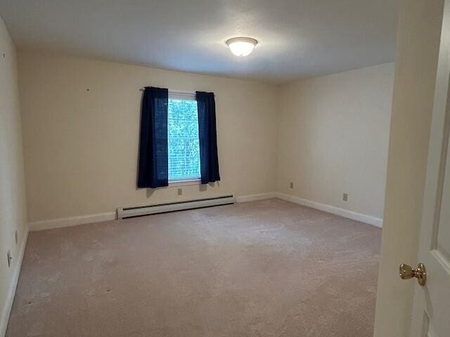 1 S Ridge Dr, Winslow, ME 04901 - carpeted spare room featuring a baseboard radiator and baseboards