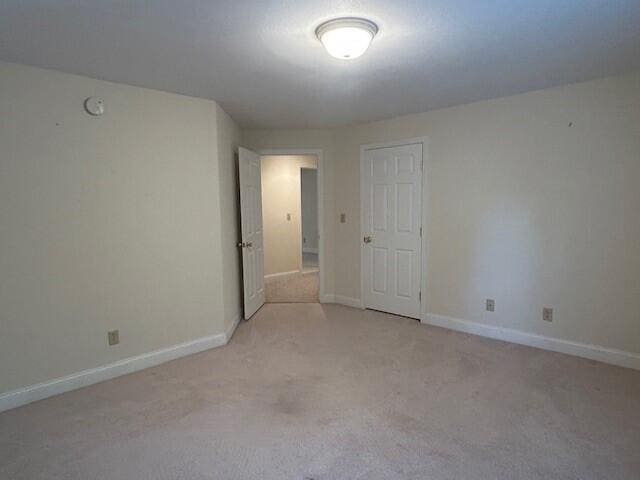 1 S Ridge Dr, Winslow, ME 04901 - unfurnished room featuring light carpet and a smoke detector