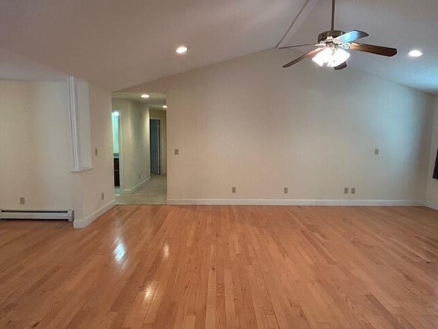 1 S Ridge Dr, Winslow, ME 04901 - empty room with a baseboard heating unit, vaulted ceiling, ceiling fan, light wood-style floors, and recessed lighting